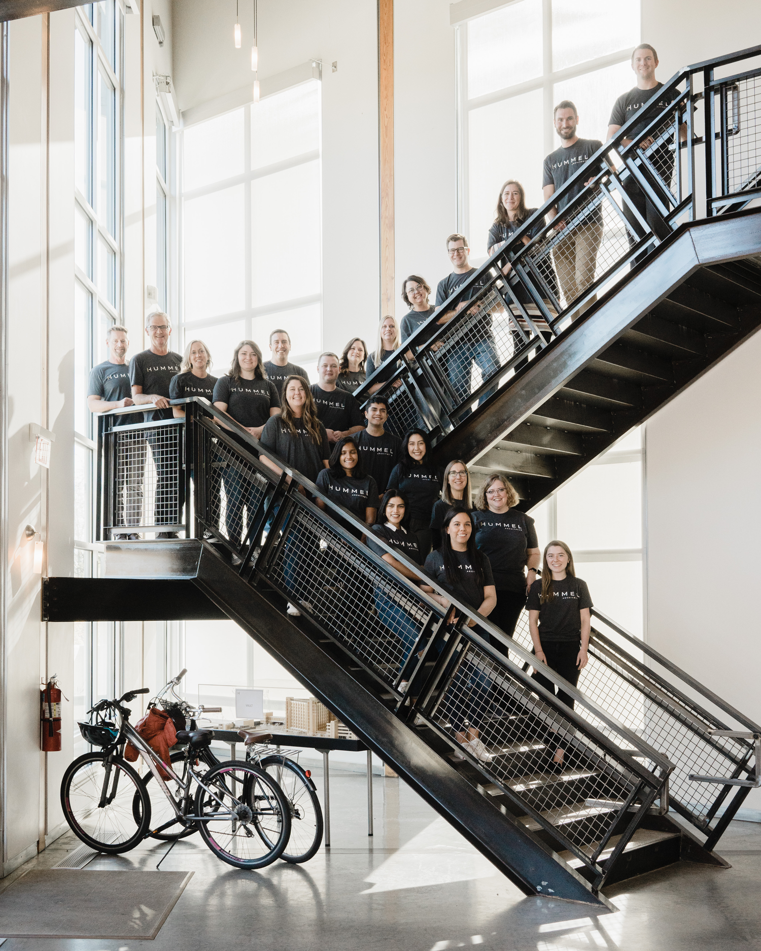 Photo of Hummel employees standing on black staircase