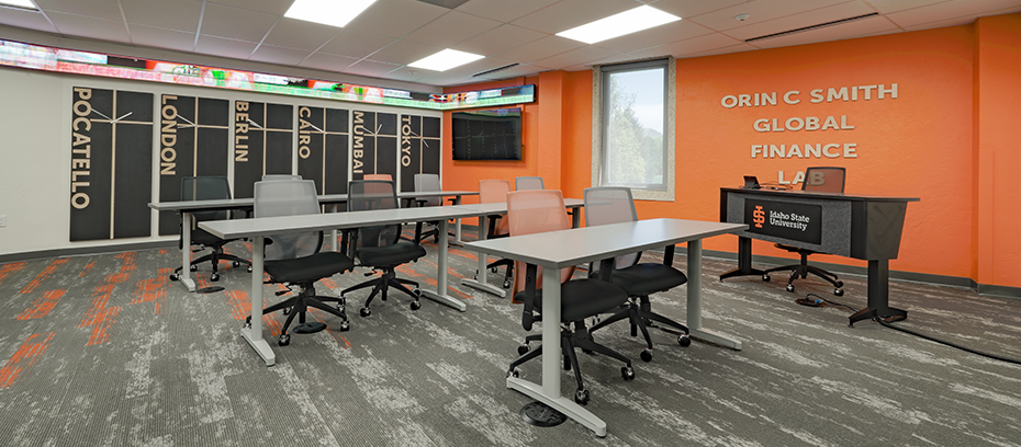 Idaho State University New Business Classroom featuring orange accents, large clocks on wall with different timezones, and desks with chairs.